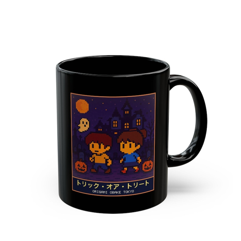 Black ceramic mug with a pixel-art haunted house trick-or-treat scene
